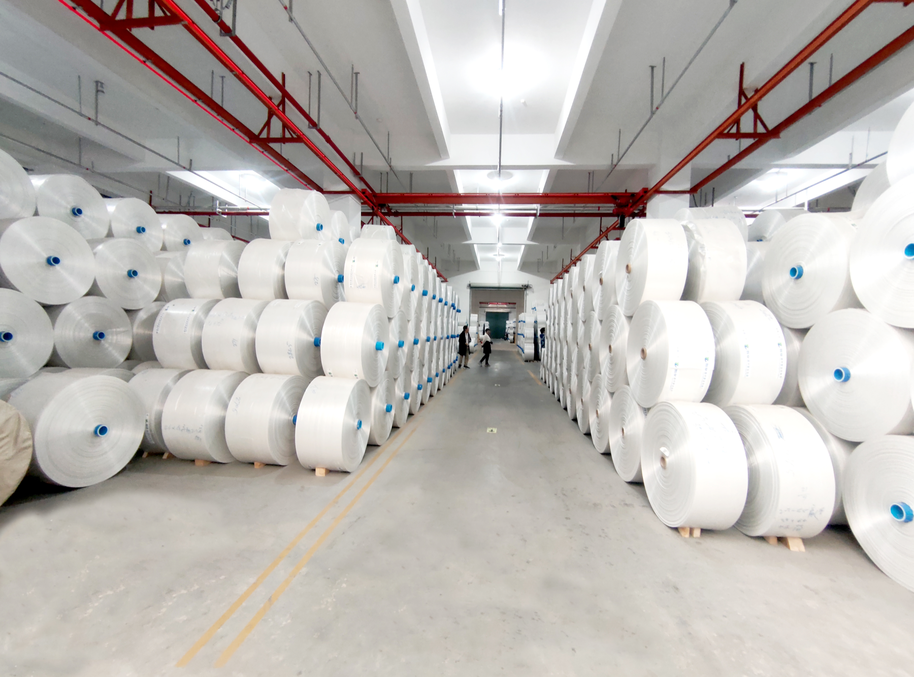 Material rolls stored inside a selected partner factory